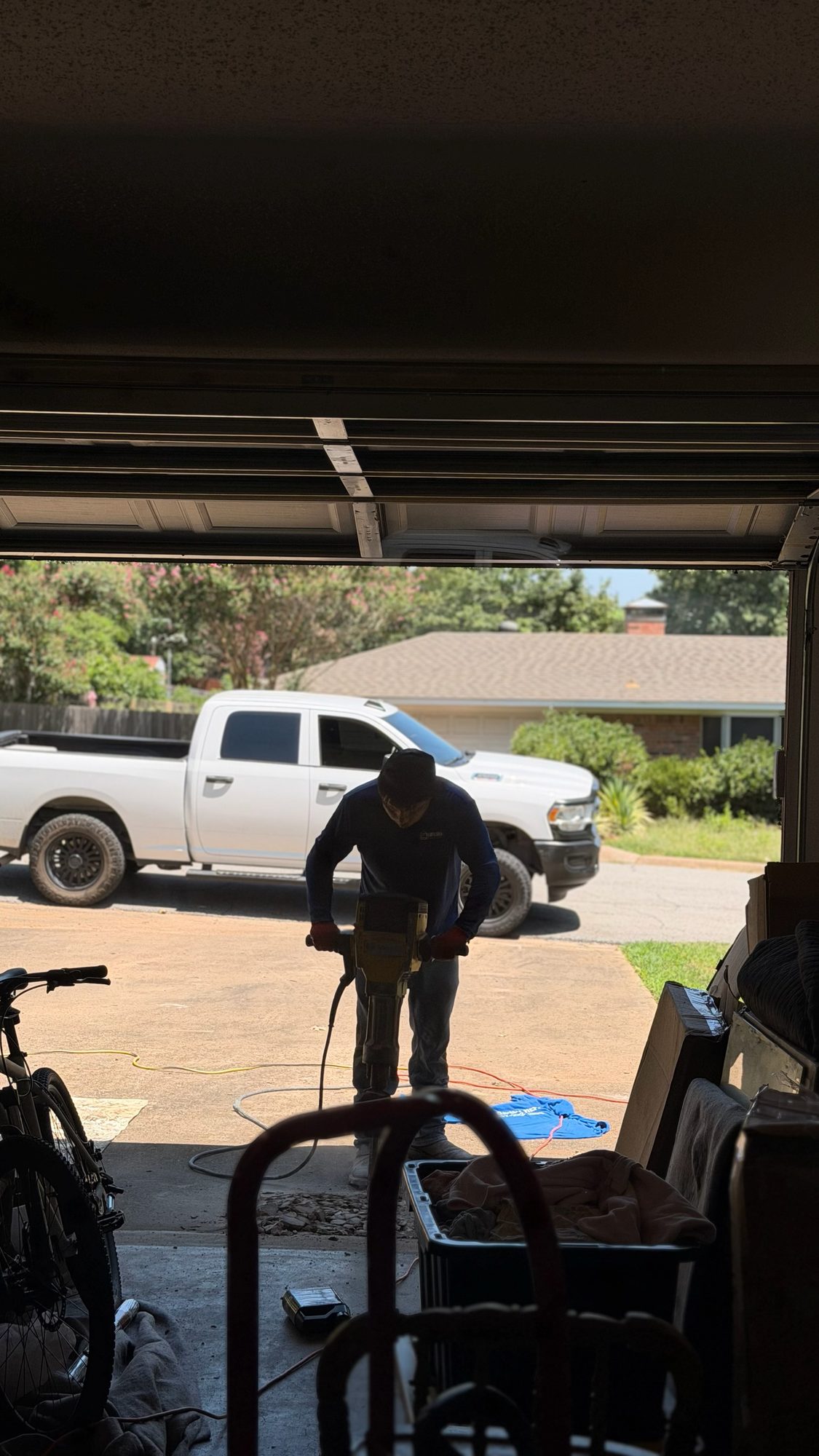 Jackhammer driveway, Imperial Foundation Repair job site in North Texas