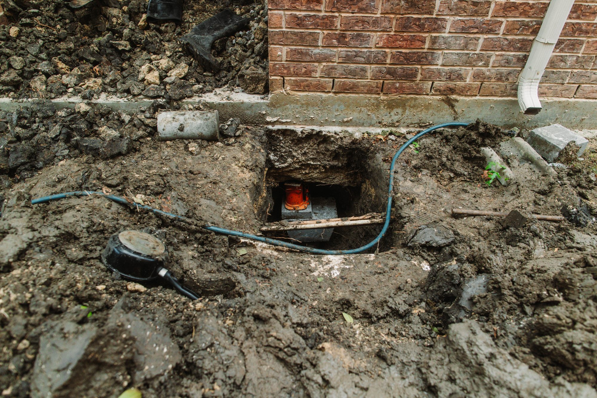 Pier hole hydraulic, Imperial Foundation Repair job site in North Texas