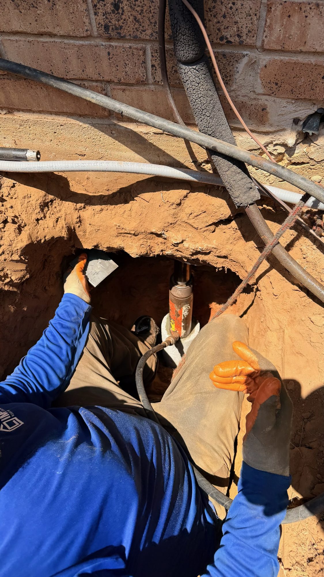 Pier set under slab closeup, Imperial Foundation Repair job site in North Texas